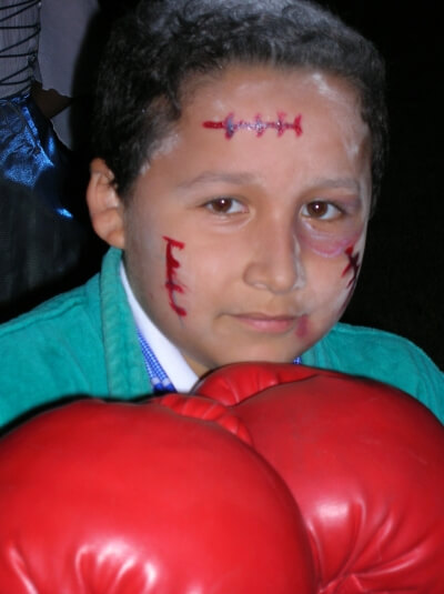 Young boy with boxing gloves