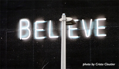 Tacky neon light saying believe