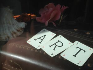 Playing cards spelling out art